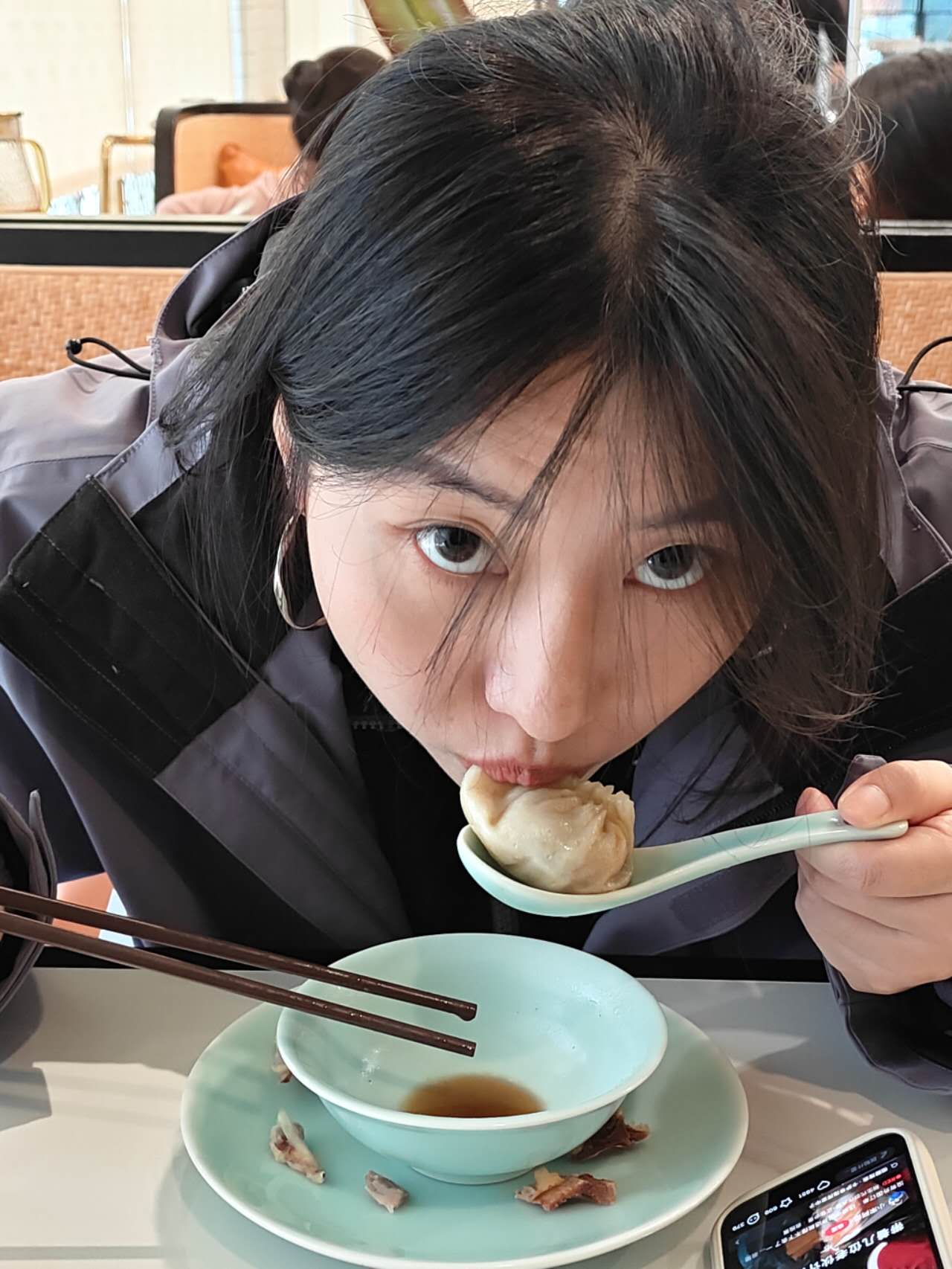 Nora eating dumplings