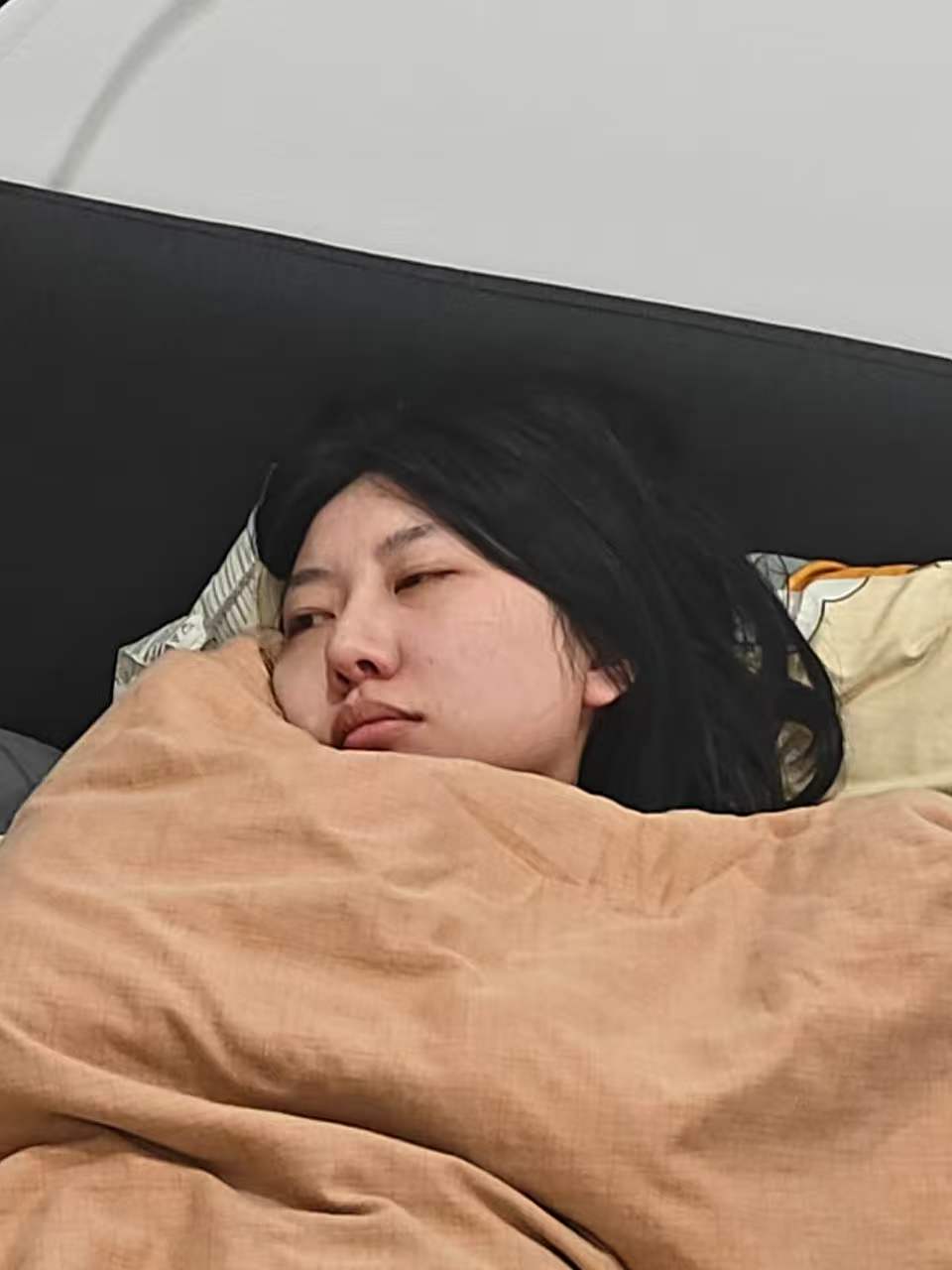 Nora sleepy in bed